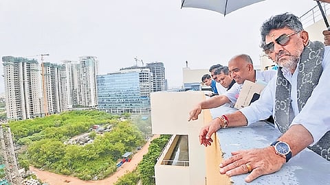 Deputy Chief Minister DK Shivakumar inspects the stormwater drain near Manyata Tech Park in Yelahanka on Thursday.