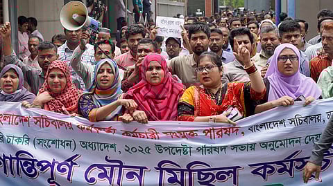 Civil officials protest inside the Secretariat building in Dhaka on May 25, 2025, demanding the repeal of a government order giving it greater power to sack employees for disciplinary breaches.