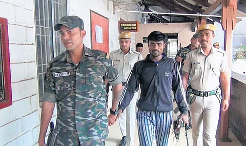 Arrested Maoist leader Kuniam Hidma with police personnel