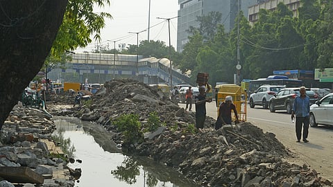Desilting work is currently underway on a drain at ITO Vikash Marg 