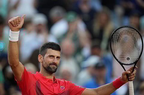 Serbia's Novak Djokovic celebrates beating France's Corentin Moutet after their second round match of the French Tennis Open, at the Roland-Garros stadium, in Paris, Thursday, May 29, 2025. 