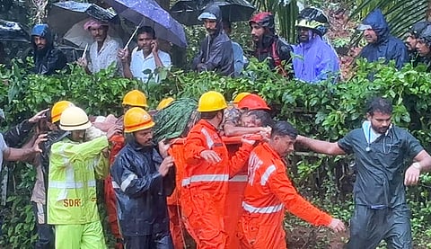A woman trapped under debris following a landslide at Montepadav near Deralakatte rescued by the NDRF personnel. 