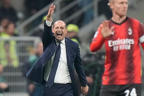 Coach Massimiliano Allegri gestures during a Serie A soccer match.