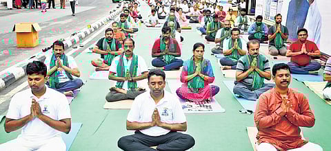 NTR Collector Lakshmisha and others perform yoga in Vijayawada 