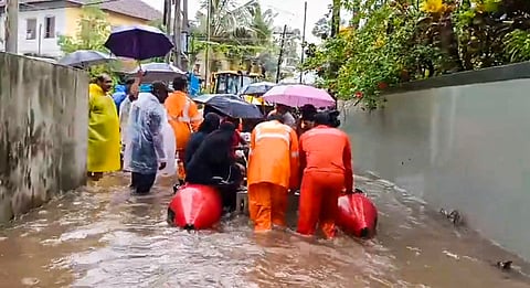 People being rescued from a flooded area amid monsoon rains, in Kannur, Kerala, Friday, May 30, 2025.