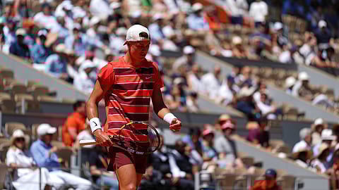 Denmark's Holger Rune walks on the court as he plays France's Quentin Halys during their third round match of the French Tennis Open, at the Roland-Garros stadium, in Paris, Friday, May 30, 2025.