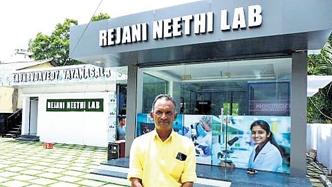 T Kunjumon in front of the Rejani Neethi Lab at Kayippuram, Muhamma.