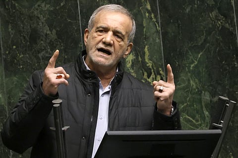 Iran's President Masoud Pezeshkian addresses members of parliament in Tehran on March 2, 2025, during impeachment proceedings against the country's finance minister. 