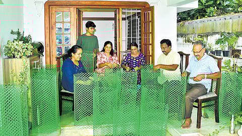 Happiness Circle volunteers prepare sapling guards on Sunday, ahead of the June 5  plantation drive on Container Road.
