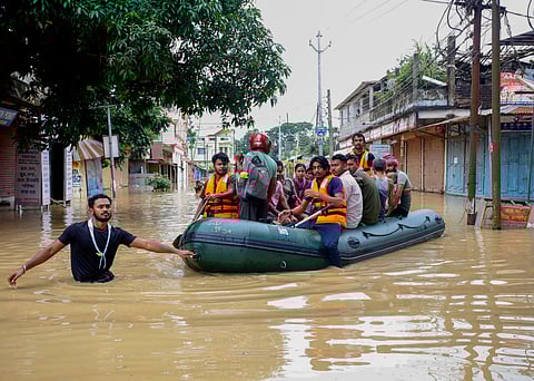  Flood-affected villagers are moved to a safer place after heavy rains at Baldakhal village on the outskirts of Agartala, Sunday, June 1, 2025. 