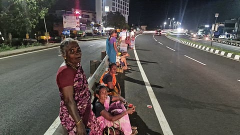 Construction workers on the Tiruchy-Madurai National Highway at Mannarpuram.