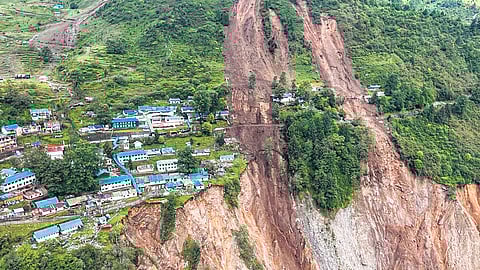 The site of the landslide (above) that hit a military camp at Chaten in Sikkim