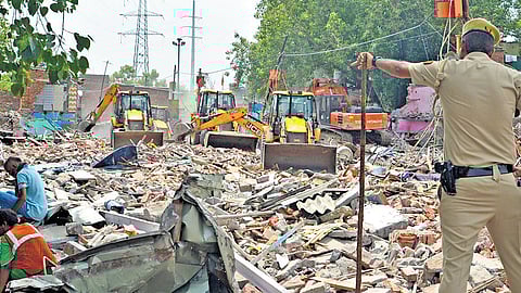 Hundreds lose homes as bulldozers raze Delhi's Madrasi Camp slum