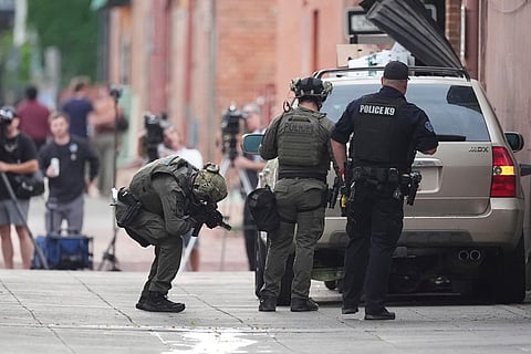 Law enforcement officials investigate after an attack on the Pearl Street Mall Sunday, June 1, 2025, in Boulder