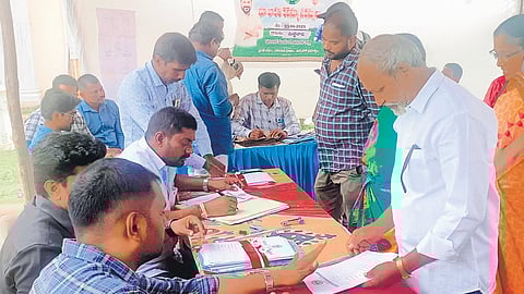 Landowners submit their applications seeking resolution of land-related issues during Bhu Bharati Revenue Sadassulu in Warangal on Tuesday.