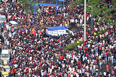Fans who got injured in stampeded being taken away in an ambulance