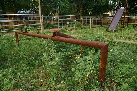 A rusted play equipment for children inside the Thanjavur City Corporation's park in Alamelu Nagar.