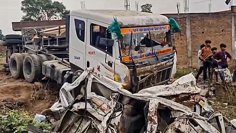 People at the accident site where a trailer overturned on a van after losing control, killing 9 out of the 11 people travelling in the van, in Jhabua, Wednesday, June 4, 2025