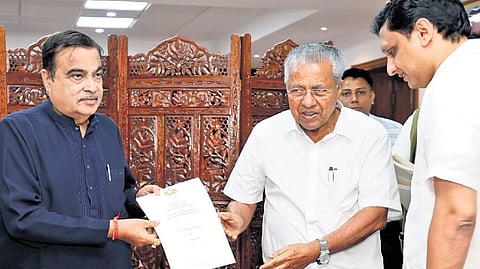 Chief Minister Pinarayi Vijayan handing over a memorandum to Union Transport Minister Nitin Gadkari, during a meeting at Transport Bhavan on Wednesday. Public Works Minister P A Mohamed Riyas is also seen