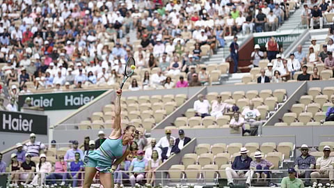 Aryna Sabalenka of Belarus serves against China's Zheng Qinwen during their quarterfinal match of the French Tennis Open at the Roland-Garros stadium in Paris, Tuesday, June 3, 2025.