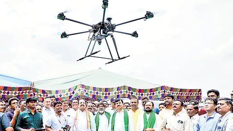 Deputy Chief Minister Mallu Bhatti Vikramarka, and ministers Ponguleti Srinivasa Reddy and Thummala Nageswara Rao during the launch of the drone survey of lands at Mulugumadu village of Khammam district on Tuesday.