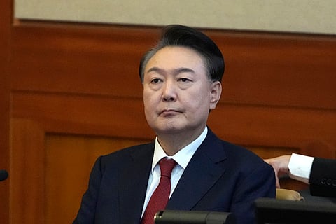 Then-South Korea's impeached President Yoon Suk Yeol attends a hearing of his impeachment trial at the Constitutional Court in Seoul, South Korea, on Feb. 11, 2025.