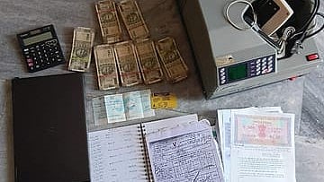 The cash, official documents and government seals recovered from the suspended Bihar ASI.