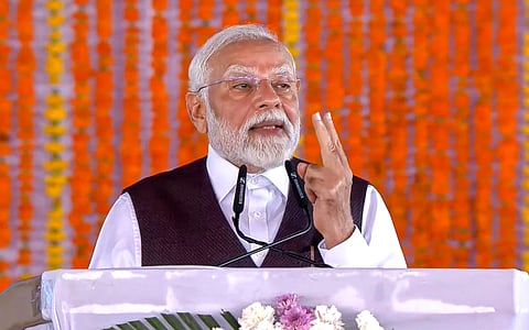 Prime Minister Narendra Modi addresses a public rally during the foundation stone laying and inauguration of various development projects at Katra, in Reasi district. 