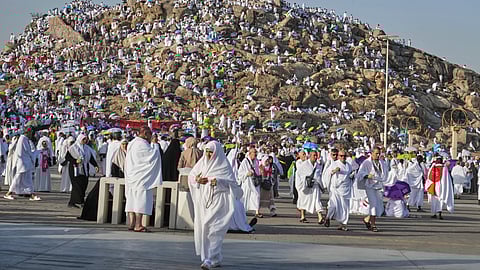 Muslim pilgrims gather on top of the rocky hill known as the Mountain of Mercy, on the Plain of Arafat, during the annual Hajj pilgrimage near the holy city of Mecca, Saudi Arabia, Thursday, June 5, 2025