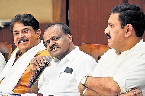 Union Minister HD Kumaraswamy, Leader of Opposition R Ashoka, and BJP state president BY Vijayendra address a press meet in Bengaluru on Friday.