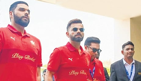 Marketing and revenue head of Royal Challengers Sports Private Limited, Nikhil Sosale (left) with Virat Kohli.