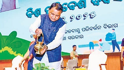 Chief Minister Mohan Charan Majhi watering a tree on the occasion of World Environment Day.