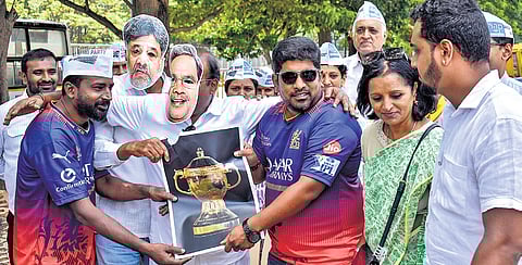 Aam Aadmi Party members stage a protest condemning the Karnataka government over the Chinnaswamy Stadium stampede, which claimed 11 lives, in Bengaluru on Saturday 