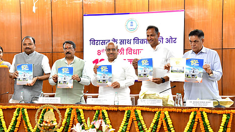 Delhi Speaker Vijender Gupta (C) releases the 100-day report card of the legislative assembly on Friday.