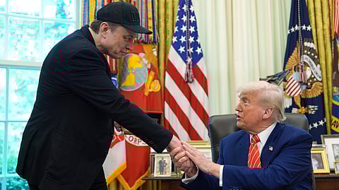 US President Donald Trump, right, shakes the hand of Elon Musk during a news conference in the Oval Office of the White House, Friday, May 30, 2025, in Washington.