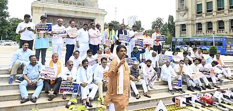 LOP R Ashoka with BJP MLAs, MLCs and other leaders protest against the state government.