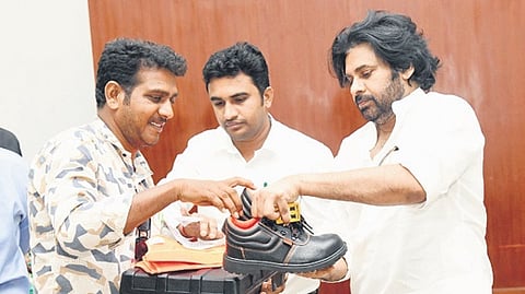 Deputy CM Pawan Kalyan gives safety shoes to electricians