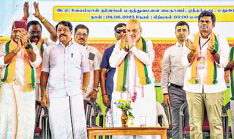 Union Home Minister Amit Shah with BJP functionaries at the party office-bearers meeting in Madurai on Sunday.