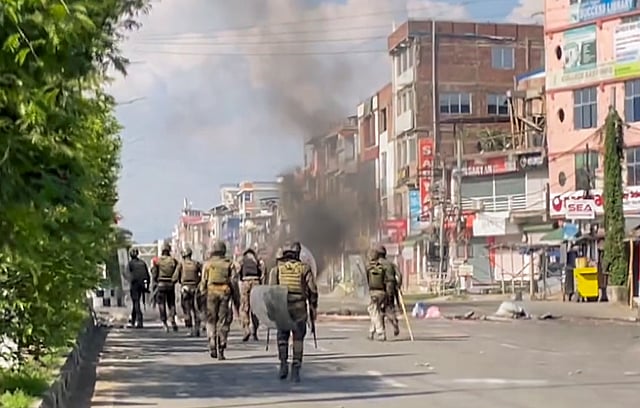 Security personnel keep vigil as protests over the arrests of Meitei outfit leaders continue in Manipur even as the administration imposed prohibitory orders and suspended internet services in five Imphal valley districts, in Imphal.