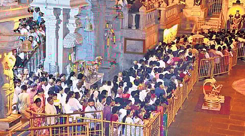 Devotees wait in queues for darshan at the Sri Lakshmi Narasimha Swamy Temple at Yadagirigutta on Sunday.