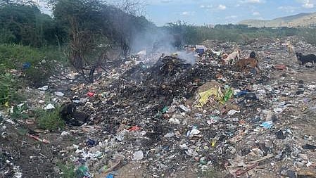 Unsegregated garbage dumped at Palar river side in Vellore's Kangeyanallur.
