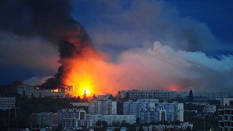 Fire and smoke rise from the site where a Russian missile struck a residential area in Kharkiv, Ukraine, Saturday, June 7, 2025,