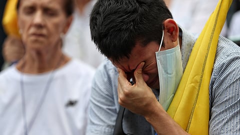 A man prays for Colombian Senator Miguel Uribe Turbay's recovery after he was shot at a political rally, in Cali, Colombia, Sunday, June 8, 2025