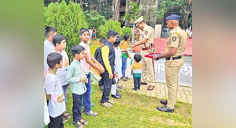 Pune deputy police commissioner
Sandeep Bhajibhakare engages with children at his village in the Solapur district of Maharashtra.
