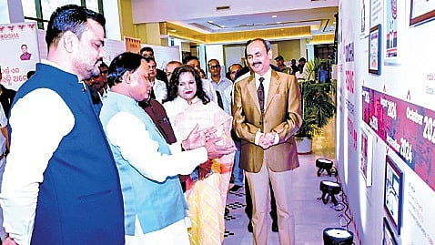 CM Mohan Charan Majhi going round an exhibition on achievements of his government on the industrial front
