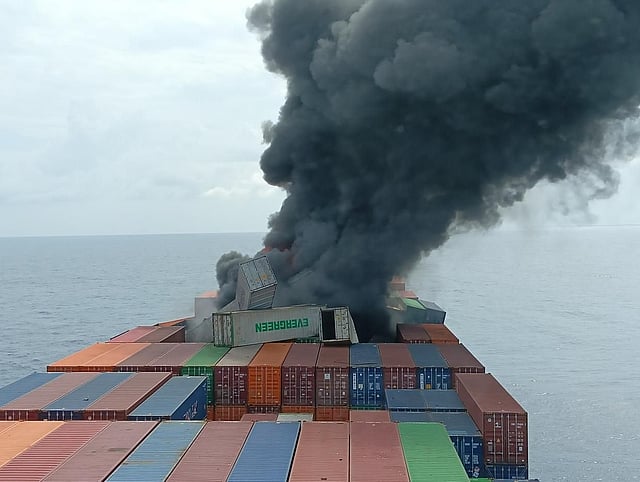 Approximately 20 containers are reported to have fallen overboard due to the blast and structural damage.