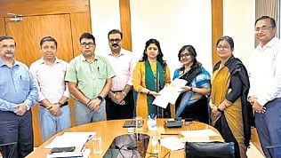 Mohanty submitting the draft to H&UD secretary Usha Padhee.