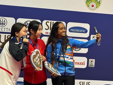 Elavenil Valarivan (R) with China's Wang Zifei (C) and Kwon Eun-ji of South Korea