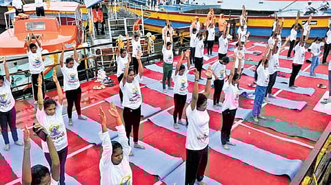 Citizens & representatives of various departments take part in Water Crafts - Floating Yoga campaign on Krishna river in NTR district 