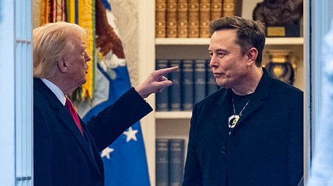 In this photo from March 14, 2025, US President Donald Trump and Elon Musk (R) speak in the Oval Office before departing the White House in Washington, DC.